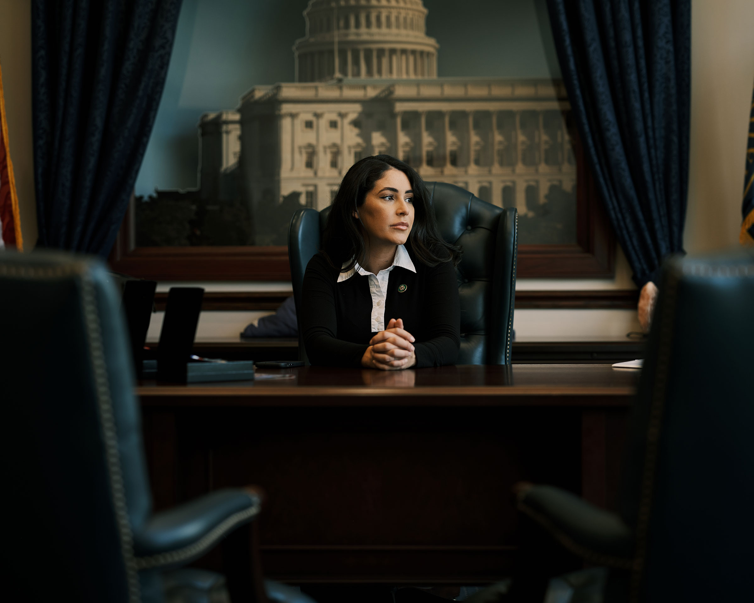 Rep. Anna Paulina Luna sits at her desk between meetings at her district office in Seminole, Fla. July 6, 2023. (Zack Wittman for TIME)