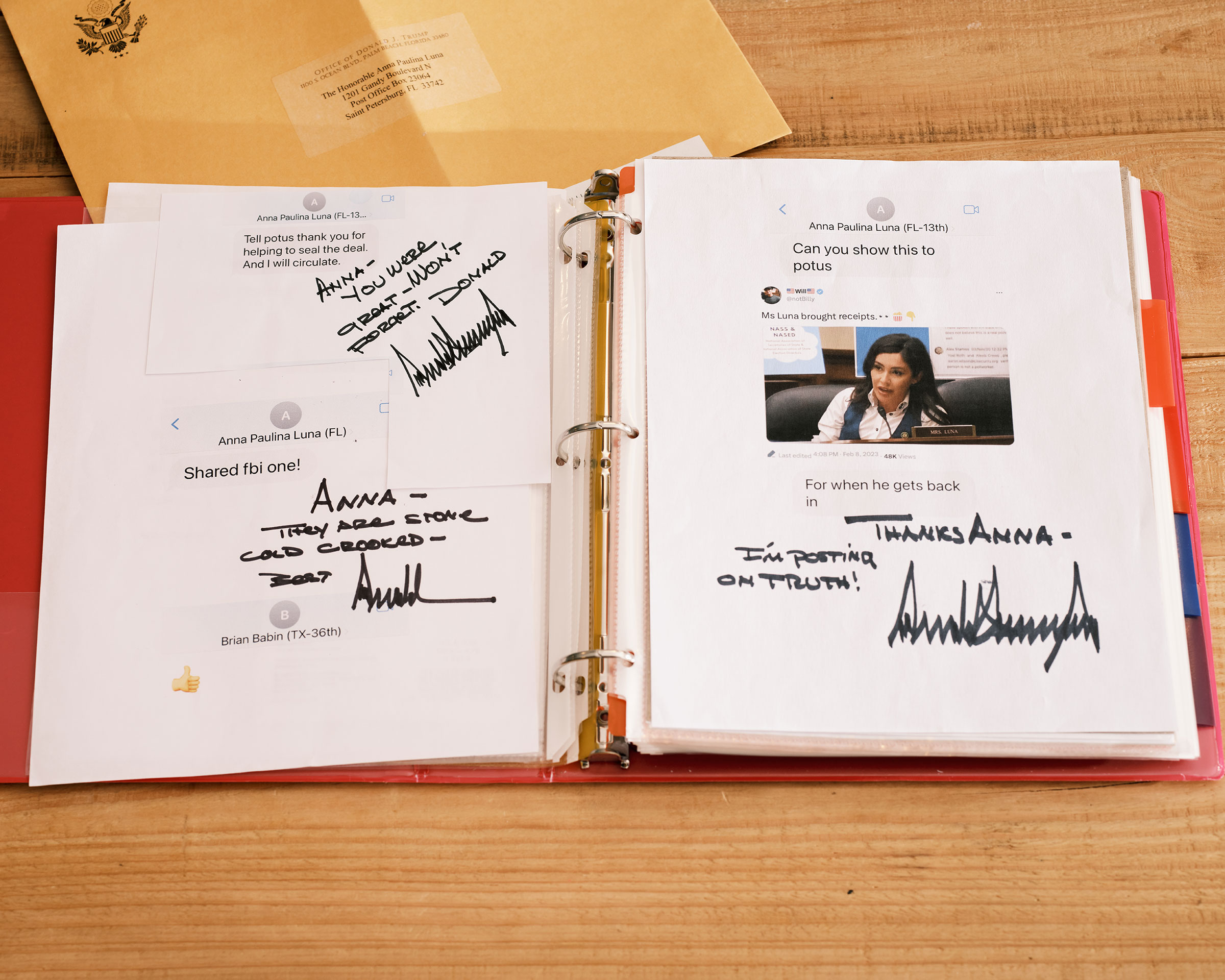 A binder full of handwritten messages and letters from President Donald Trump is seen at Luna’s home in Florida. (Zack Wittman for TIME)