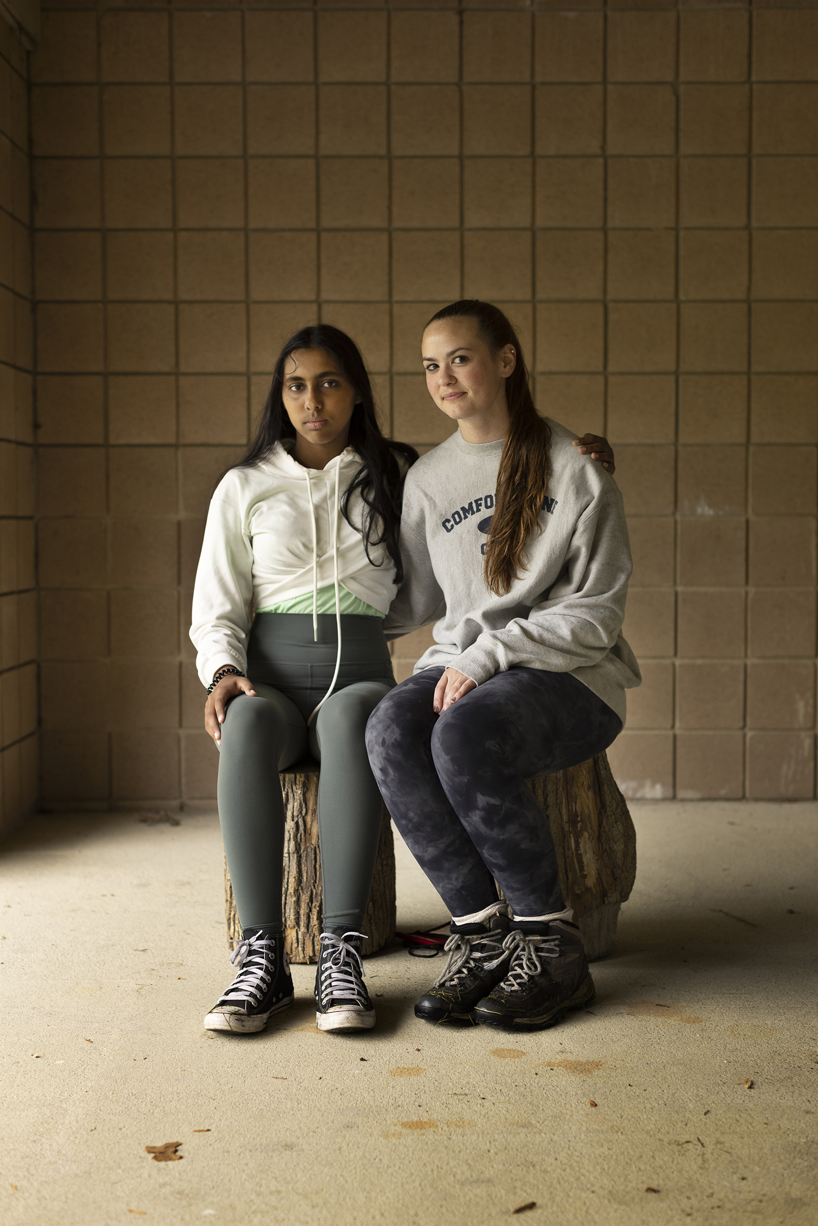 Camper Saanvi Kulkarni, left, with her buddy Kelly Nilsen in front of the gym.
