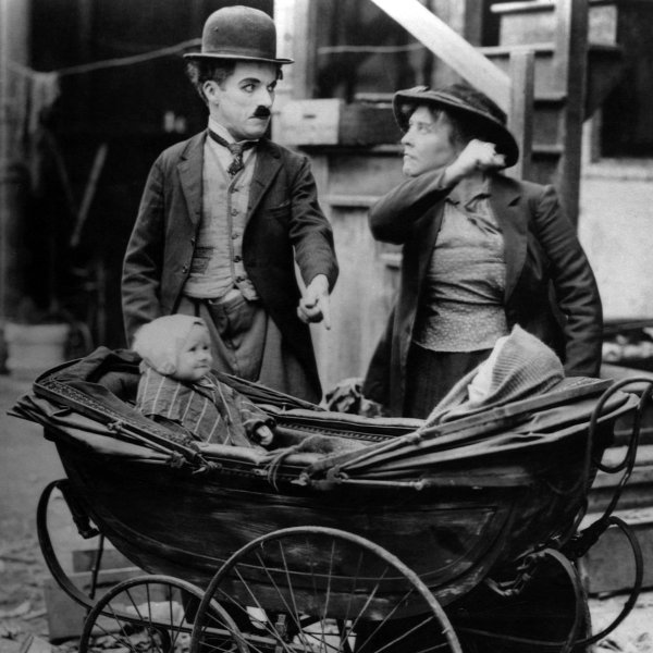 Charles Chaplin and Edith Wilson in The Kid.
