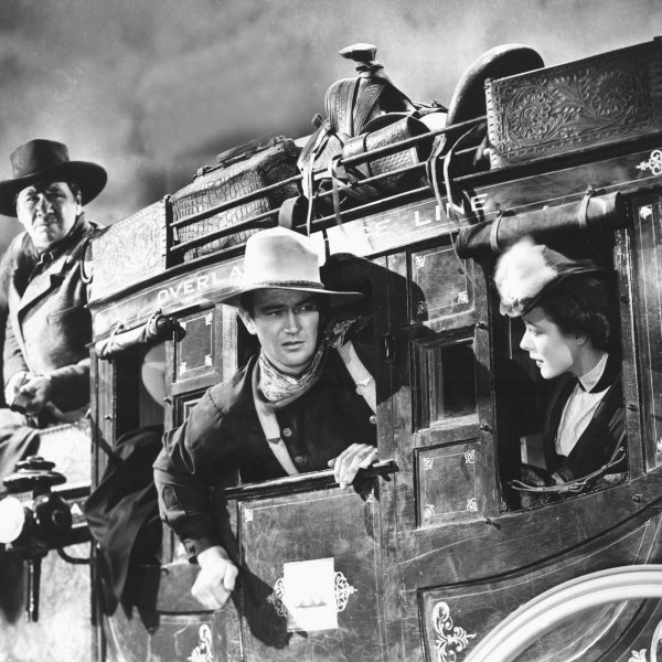 George Bancroft, John Wayne, and Louise Platt in Stagecoach.