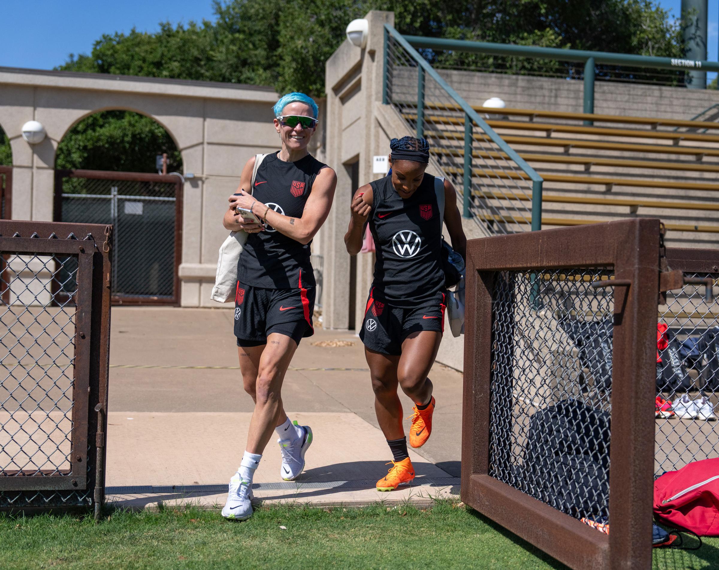 Megan Rapinoe and Crystal Dunn arrive at the field before USWNT training
