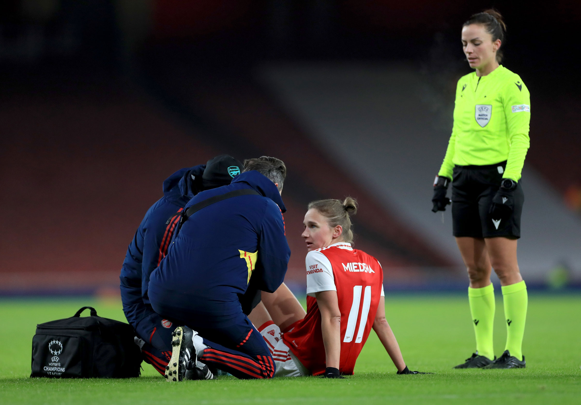 Vivianne Miedema receives medical attention during a UEFA Women’s Champions League match at the Emirates Stadium in London on Dec. 15, 2022. Miedema will miss the Women’s World Cup for the Netherlands due to the ACL injury sustained late last year. (Bradley Collyer—PA Images/Getty Images)
