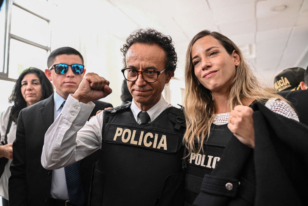 Journalist and presidential candidate for the Construye party, Christian Zurita (C), poses next to his running mate, vice presidential candidate Andrea Gonzalez (R), in Quito on Aug. 13, 2023. Zurita will replace journalist Fernando Villavicencio, who was murdered after a political rally on Aug. 9 in Quito.
