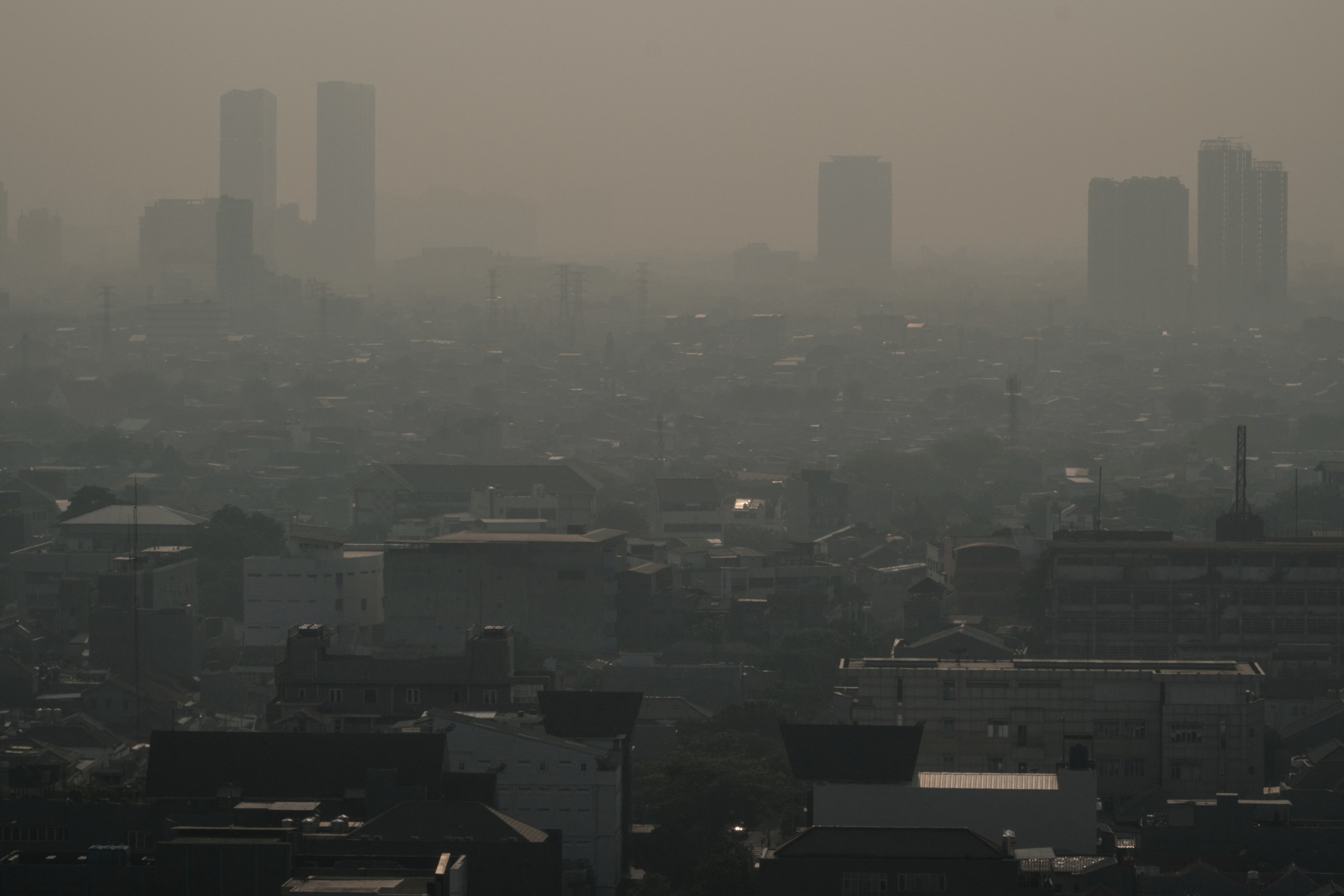The haze caused by air pollution in downtown Jakarta on August 16, 2023. (Yasuyoshi Chiba—AFP/Getty Images)