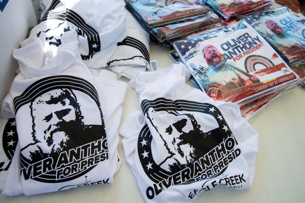 Oliver Anthony merchandise at the Eagle Creek Golf Club concert on August 19, 2023 in Moyock, North Carolina. (Mike Caudill—Billboard/Getty Images)