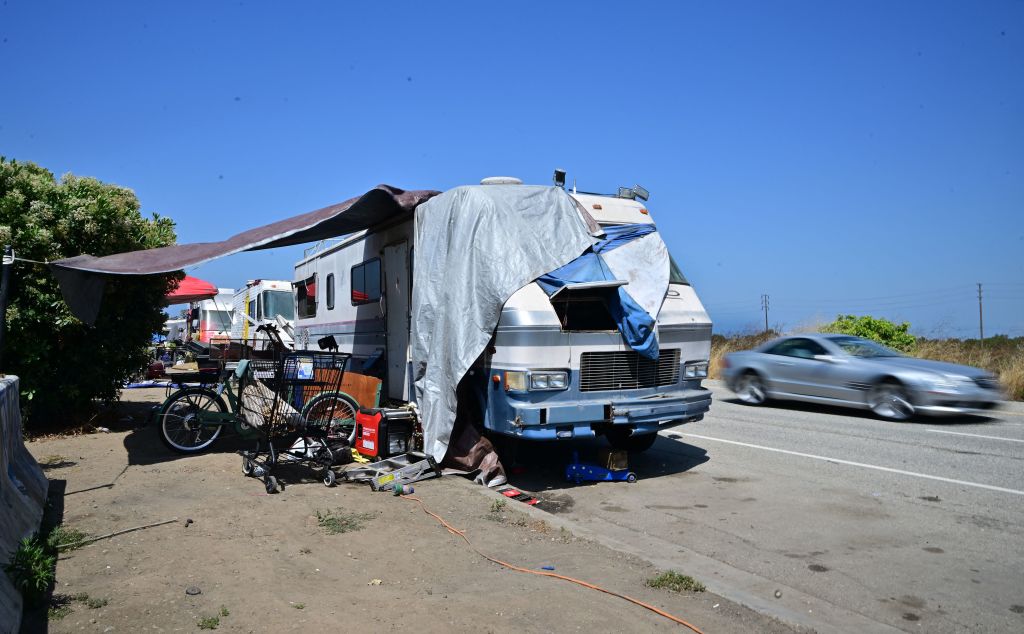 Recreational vehicles house residents living beside the Ballona Wetlands, along Jefferson Boulevard in Los Angeles, California, on July 5, 2023. A third of the homeless population of the United States is in California, a state that paradoxically represents the fifth largest economy in the world. A high percentage live in caravans, vans, or vehicles that pile up in various makeshift camps in Los Angeles and surrounding cities.  (Frederic J. Brown—AFP/Getty Images)