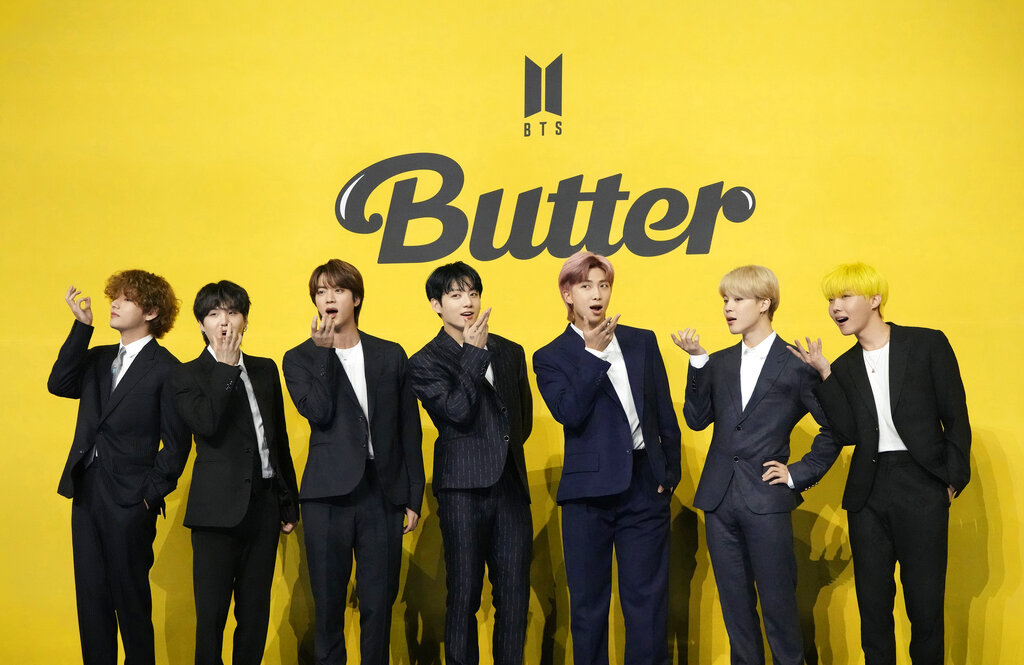 Members of South Korean K-pop band BTS, V, SUGA, JIN, Jung Kook, RM, Jimin, and j-hope from left to right, pose for photographers ahead of a press conference to introduce their new single "Butter" in Seoul, South Korea, Friday, May 21, 2021.