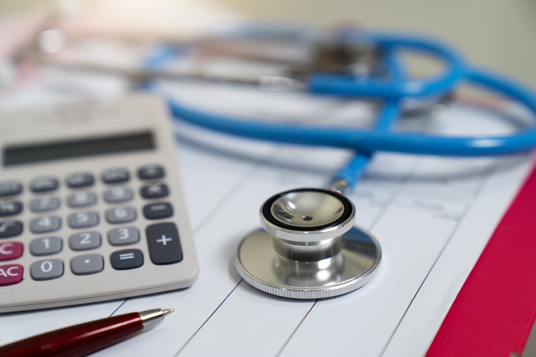 Cost of health care concept, stethoscope and calculator on document (Getty Images)