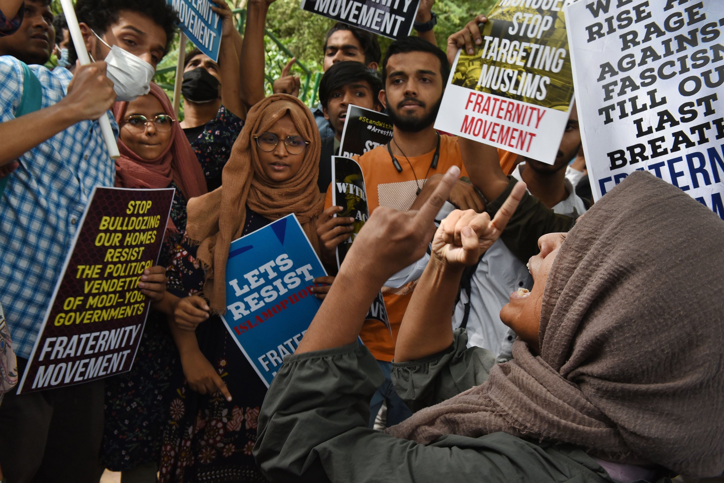 Demonstrators hold placards against the demolition of the house of activist Afreen Fatima and her father Javed Mohammad on June 13, 2022 in Delhi. (Ajay Aggarwal—Hindustan Times/Getty Images)