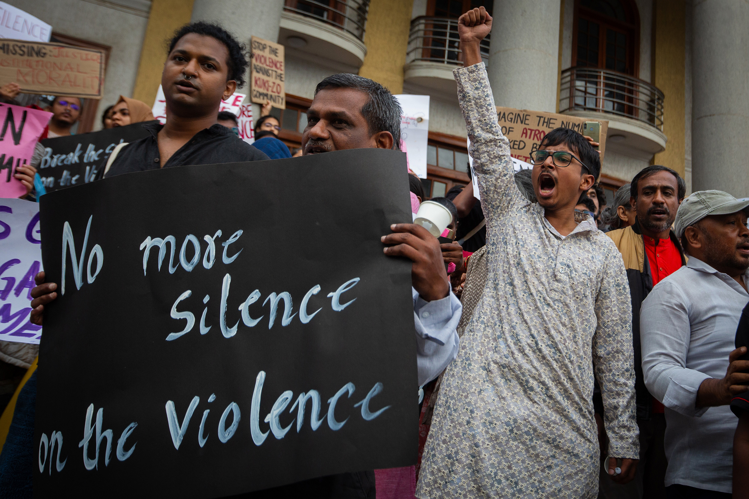 People shout slogans and hold up placards during a protest against violence in the northeastern Indian state of Manipur on July 21 in Bengaluru, India.  (Abhishek Chinnappa—Getty Images)