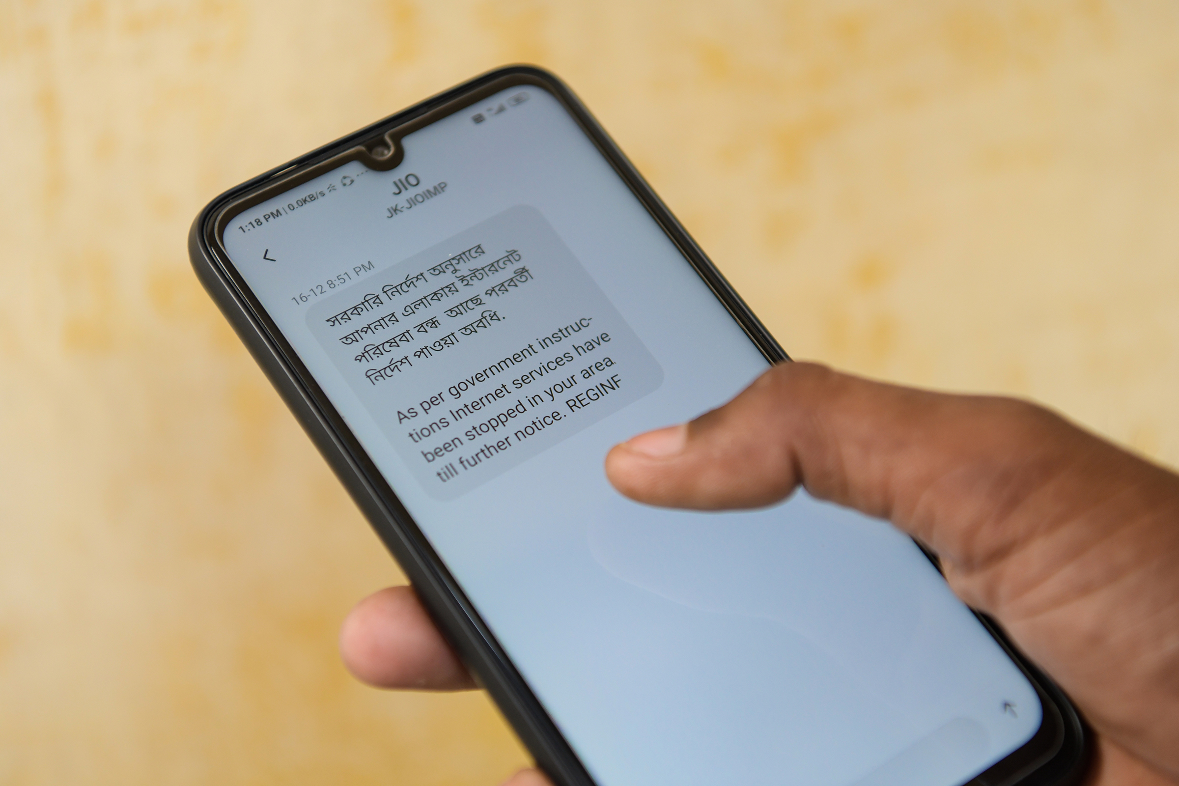 A notification message is displayed on a smartphone regarding internet service being suspended as per the government instructions in Kolkata, on Dec. 17, 2019. According to officials, the government has shut down Internet services in several districts to prevent circulation of fake news on the nationwide protest against NRC, CAB.