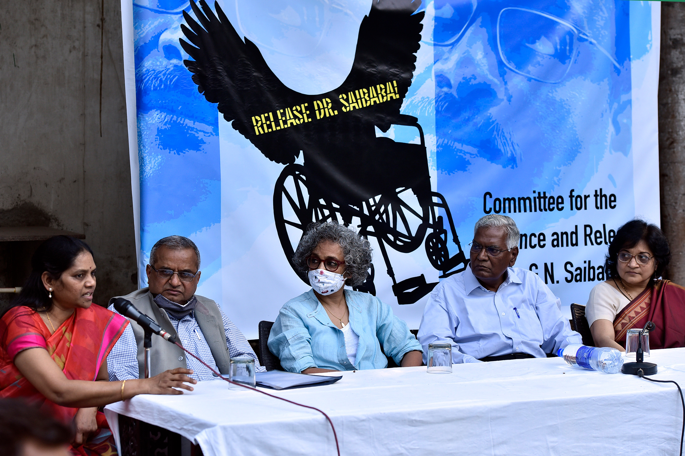 Senior advocate Prashant Bhushan, CPI leader D. Raja, author-activist Arundhati Roy, former DUSU President Nandita Narain, and others during a press conference demanding the immediate release of Saibaba on March 10, 2021 in New Delhi. (Sanjeev Verma—Hindustan Times/Getty Images)