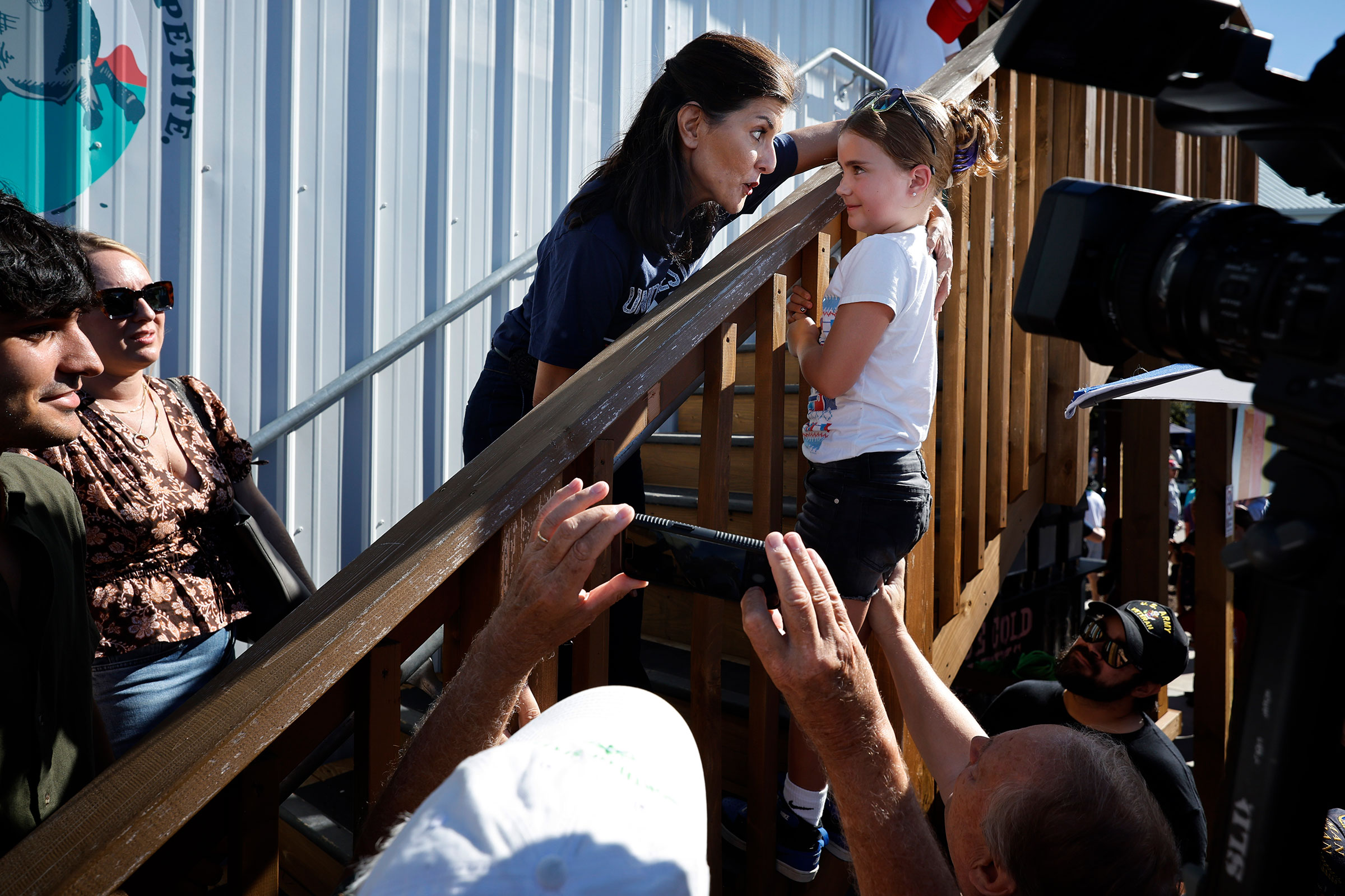 Former South Carolina Governor and Ambassador to the United Nations Nikki Haley speaks with a young fairgoer  on Aug. 12. (Chip Somodevilla—Getty Images)
