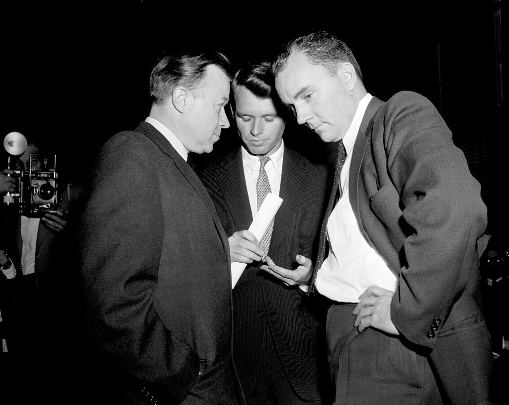On Mar. 27, 1958, Walter Reuther (left), president of the UAW, goes into a huddle with Senate Rackets Committee Counsel Robert F. Kennedy (center) and Jack Conway, assistant to the UAW Chief, before Reuther testified in the Senate Committee's probe of the 4-year-old strike by the UAW against the Kohler Company, a Sheboygan, Wisconsin plumbing fixture firm. Reuther opened his testimony by charging that the Kohler Company has refused to recognize the law during the bitter strike. (Bettmann Archive)