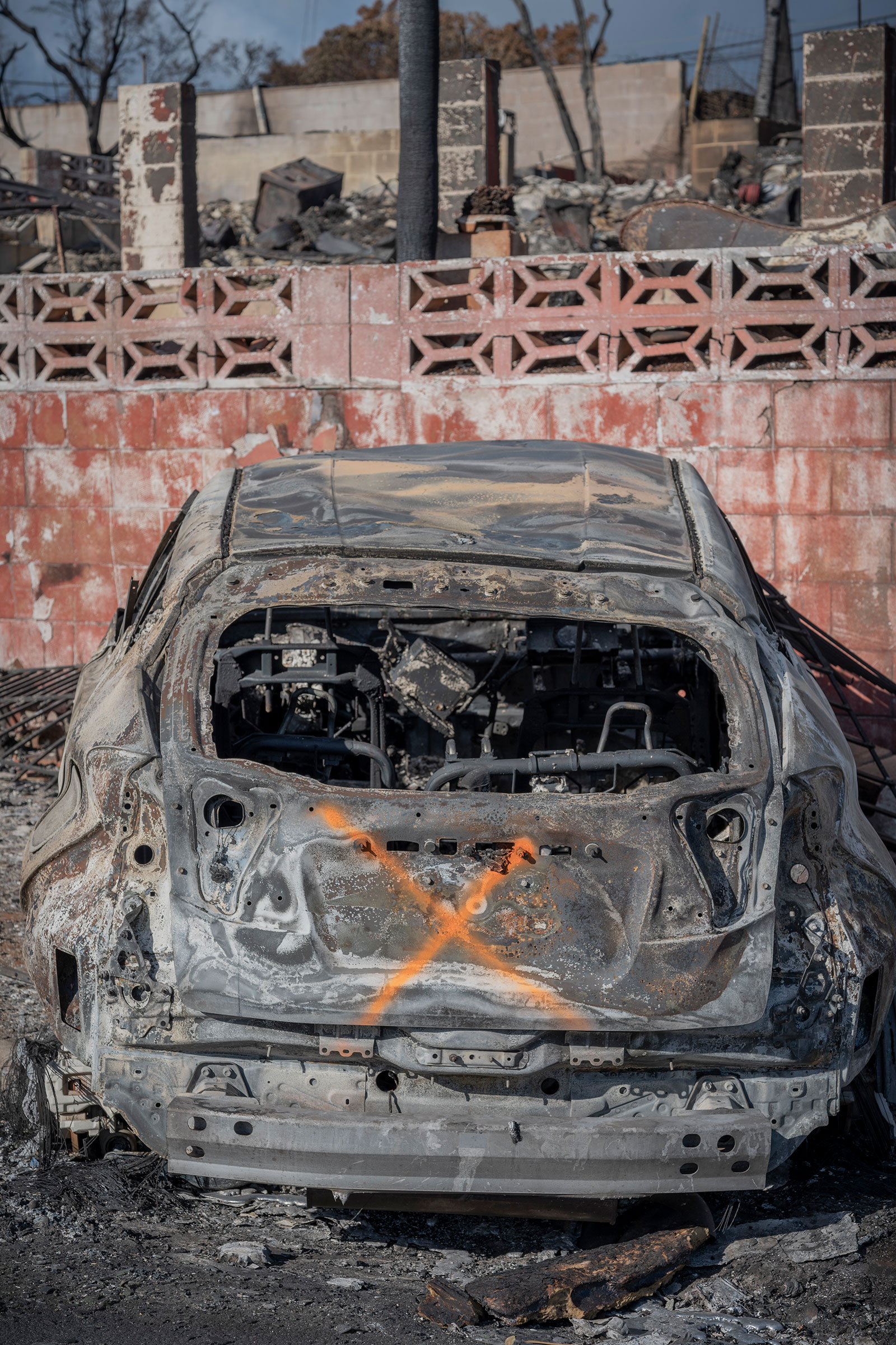 August 14, 2023  Lahaina, Hawaii  Scenes of devastation where deadly fires swept through this popular island town on August 8, 2023. Some of the burned vehicles show an “X” which was painted by search and rescue crews signifying the vehicle has been checked and does not contain human remains. Photo by David Butow for TIME.
