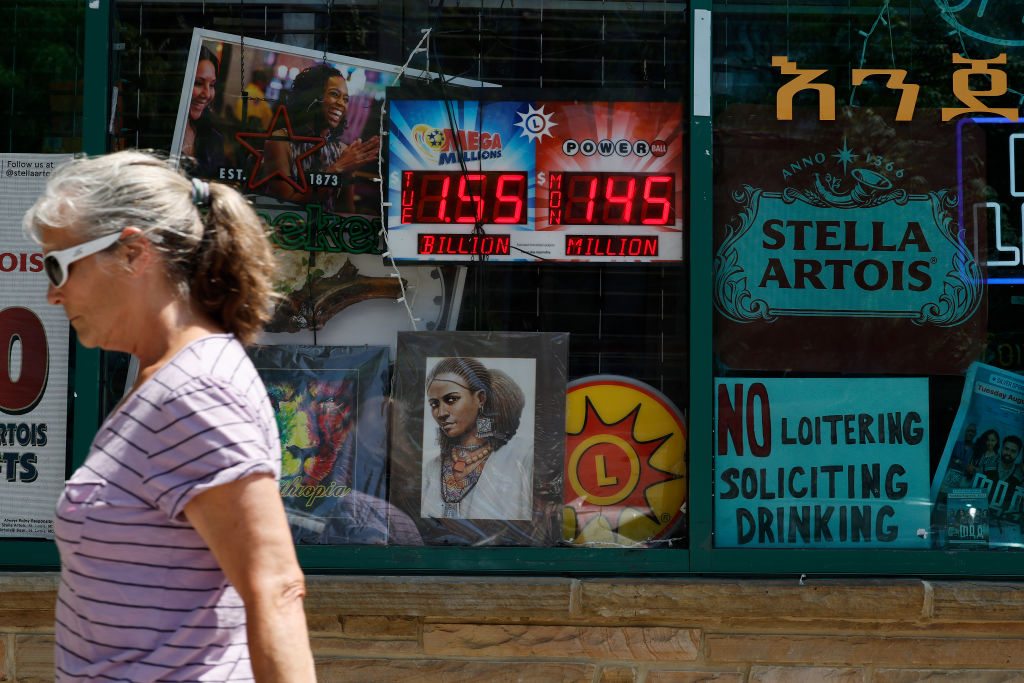 An electronic sign advertises the Mega Millions and Power Ball jackpot amounts outside a convenience store on Aug. 07, 2023 in Silver Spring, Maryland.
