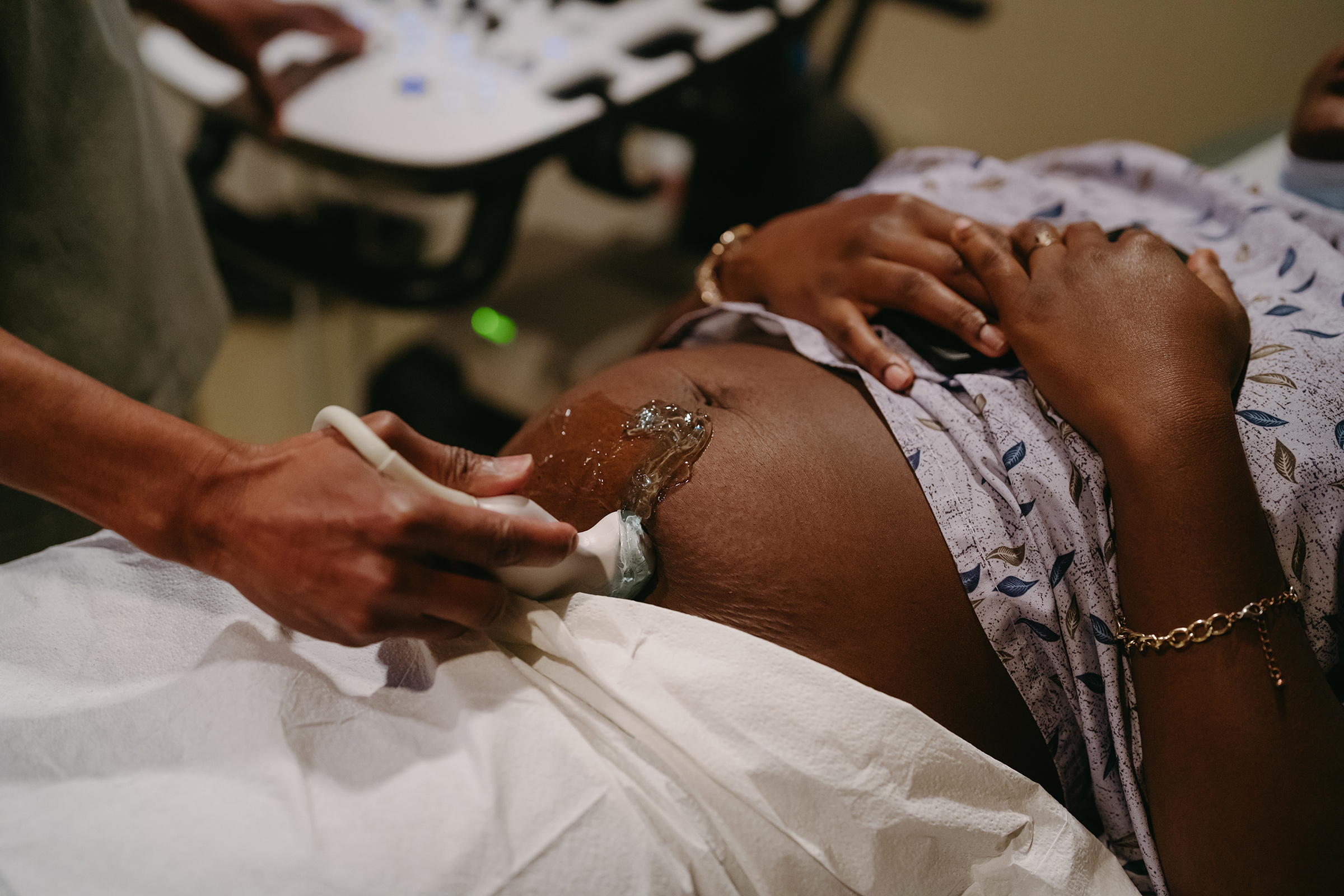 Dr. Balthrop performs an ultrasound on a patient who is 14 weeks pregnant. (Lucy Garrett for TIME)
