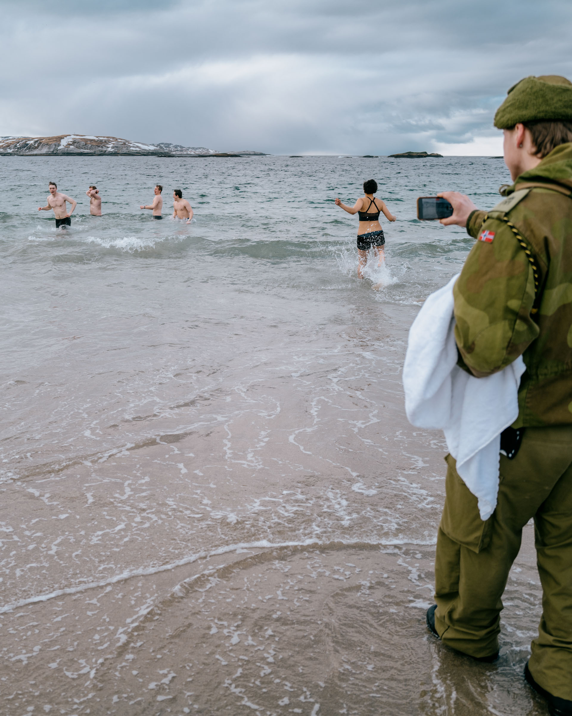 Young Norwegian soldiers swim in the frigid Barents Sea on Easter.
