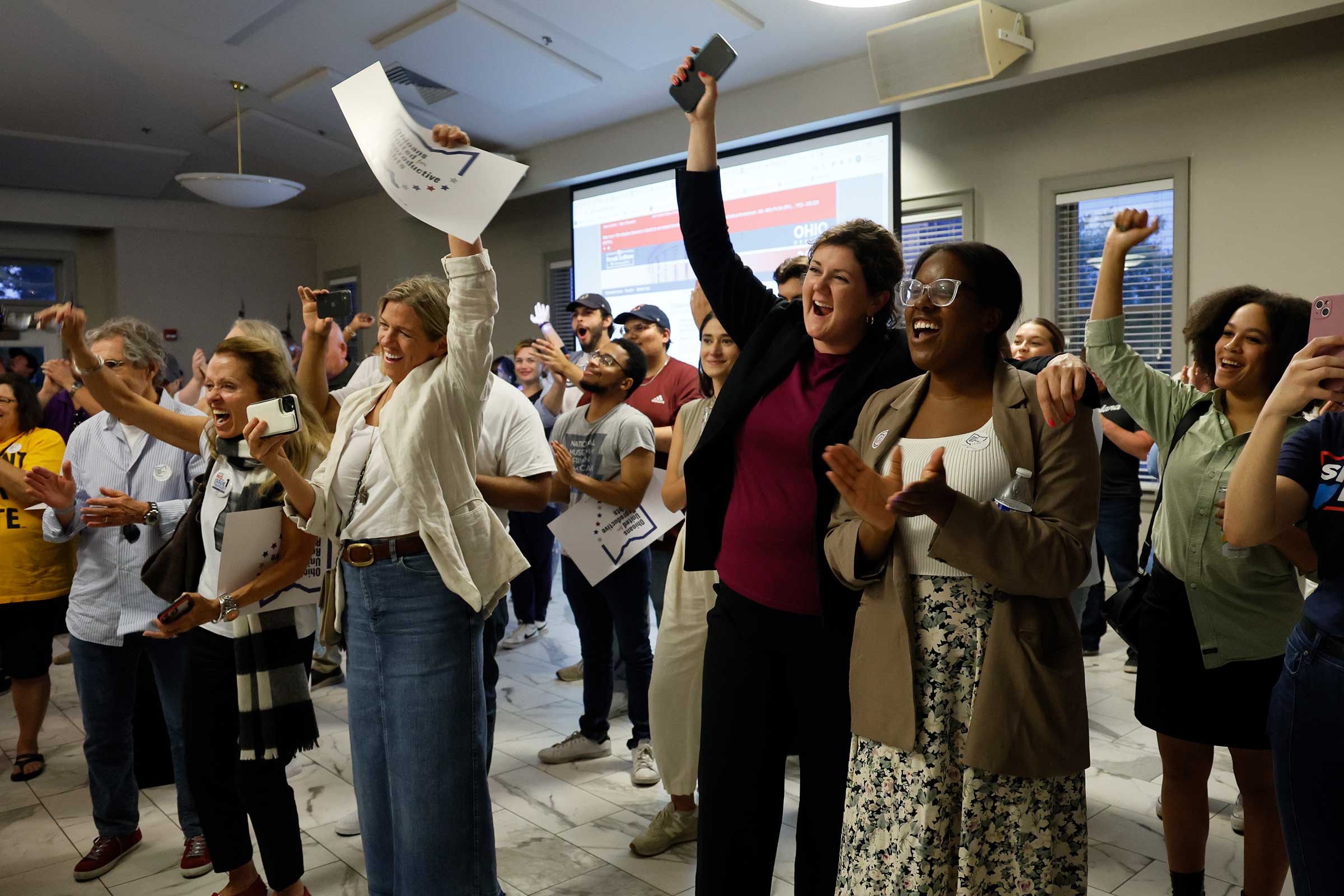 People celebrate the defeat of Issue 1 during a watch party Tuesday, Aug. 8, 2023, in Columbus, Ohio. Ohio voters have resoundingly rejected a Republican-backed measure that would have made it more difficult to pass abortion protections.  (Jay LaPrete—AP)