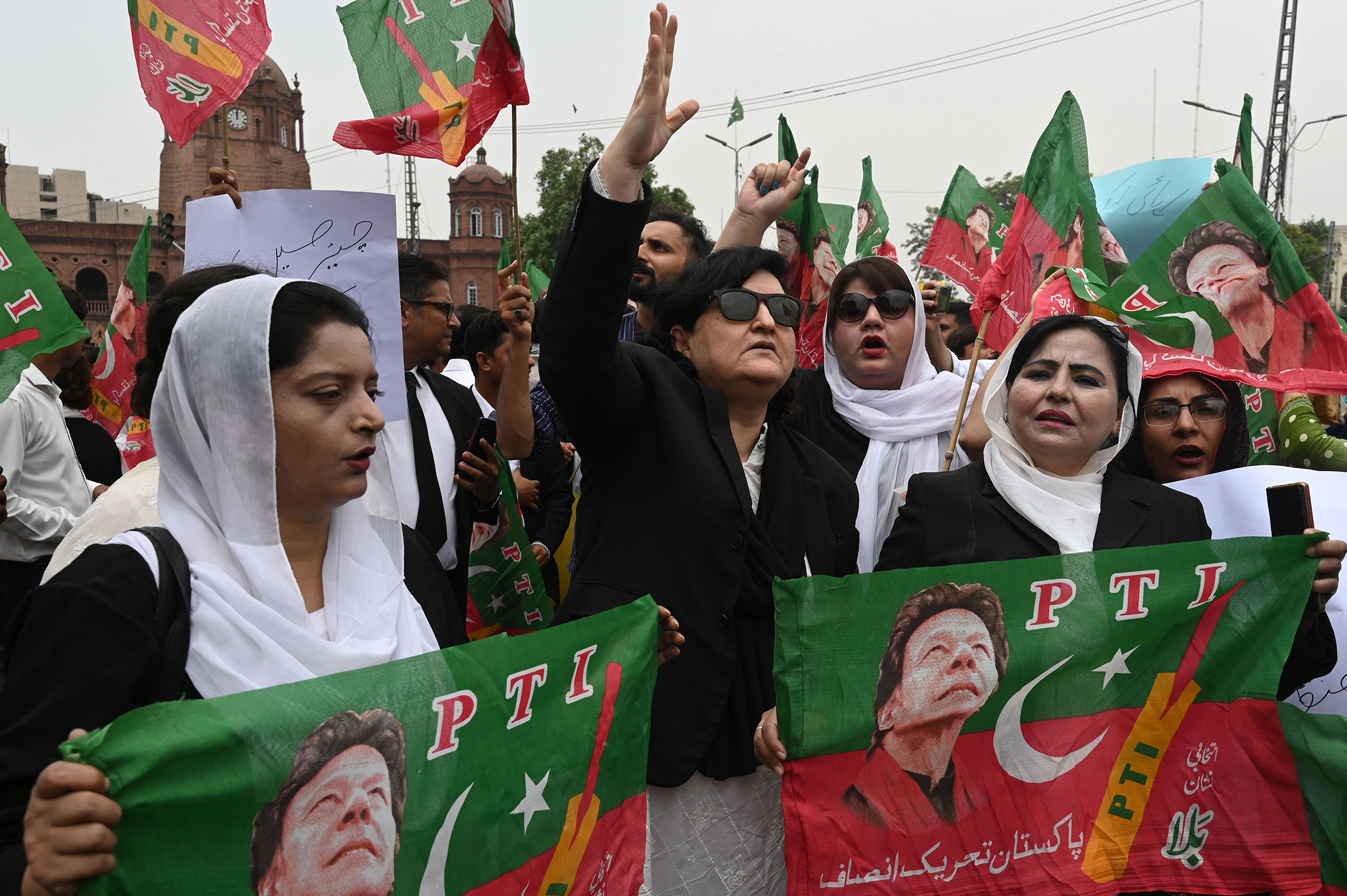 Supporters of the Pakistan Tehrik-i-Insaf (PTI) party gather in protest after former Pakistani Prime Minister Imran Khan's arrest, outside the High court in Lahore, Pakistan, on Aug. 7.