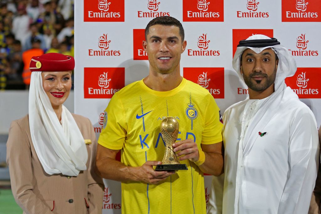 Nassr's Portuguese forward Cristiano Ronaldo poses with his top scorer trophy following the 2023 Arab Club Champions Cup semi-final football match between Saudi Arabia's Al-Nassr and Iraq's Al-Shorta at Prince Sultan bin Abdul Aziz Stadium in Abha on Aug. 9, 2023.