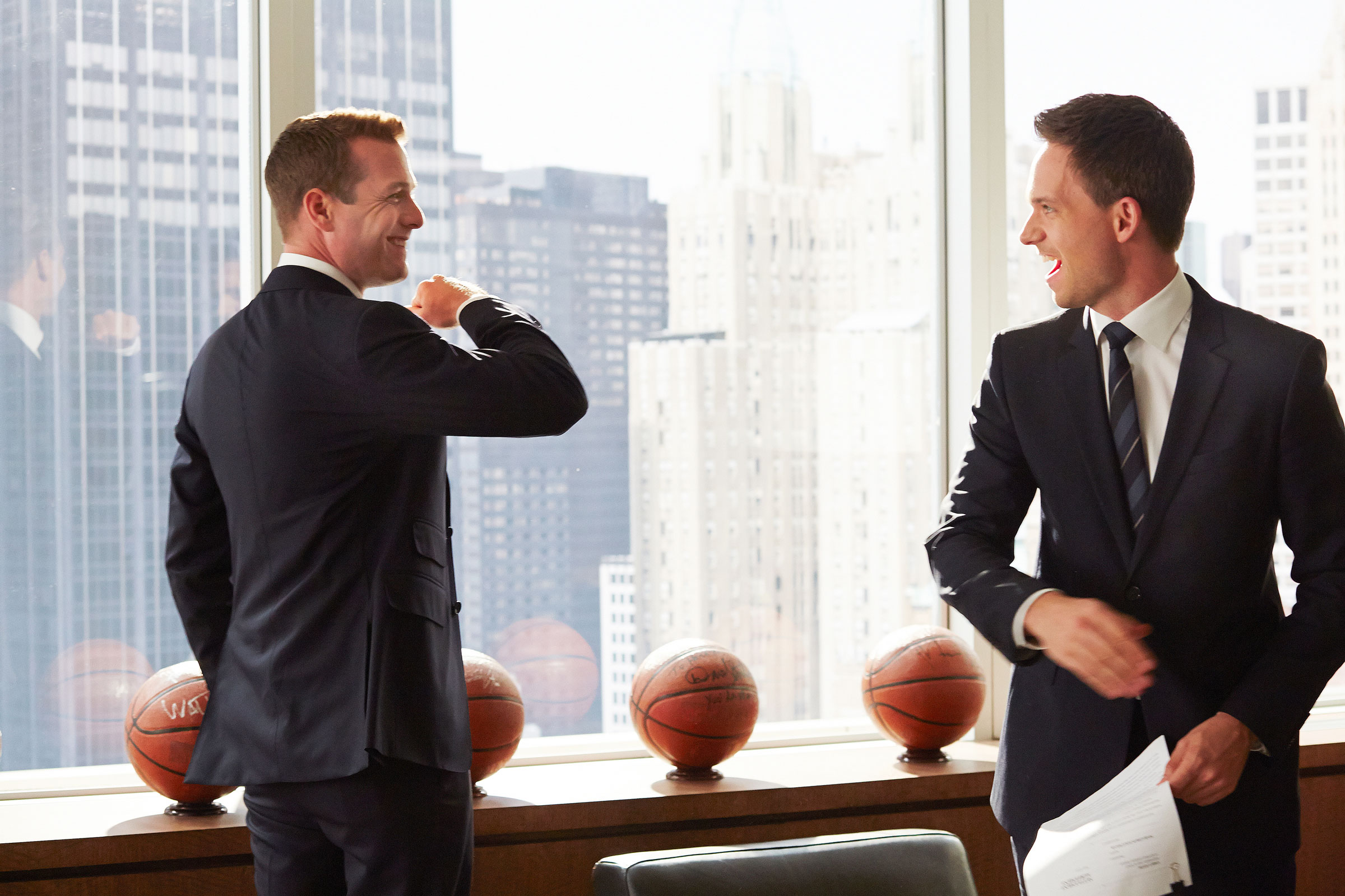 still from season 3 of Suits showing Gabriel Macht as Harvey Specter and Patrick J. Adams as Michael Ross