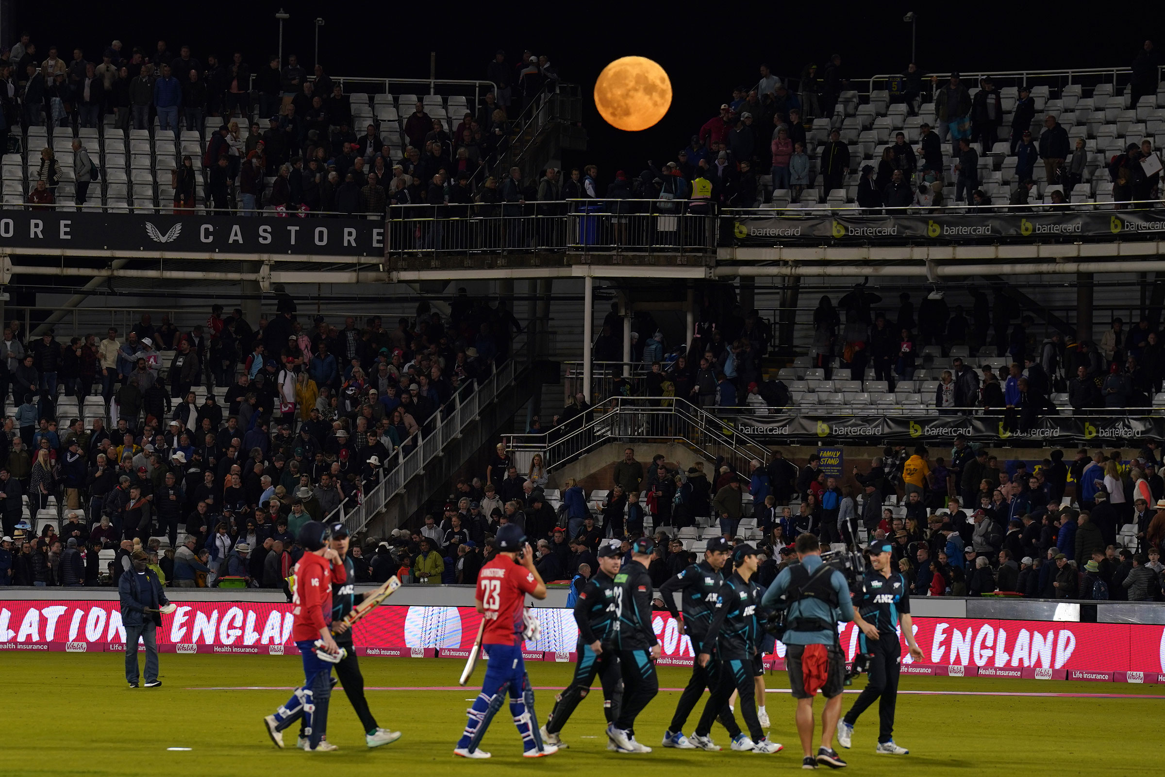 The super blue moon is visible over the stands after the first Vitality IT20 match at the Seat Unique Riverside, Durham, England on Aug. 30, 2023. (Owen Humphreys—PA Images Reuters)