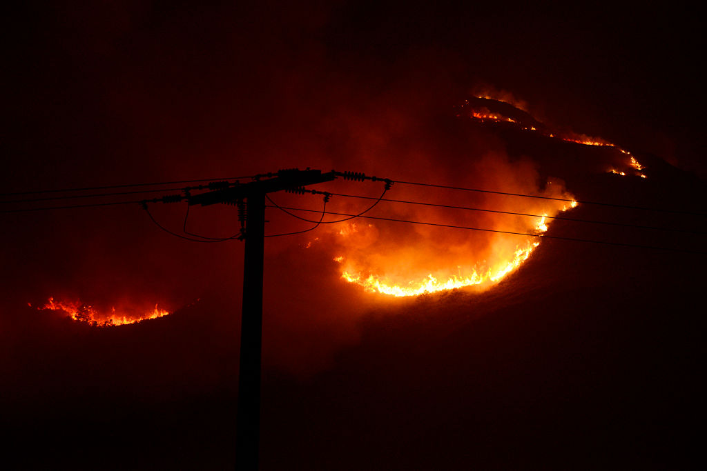 A wildfire burns near power lines in Galicia, Spain in 2022.