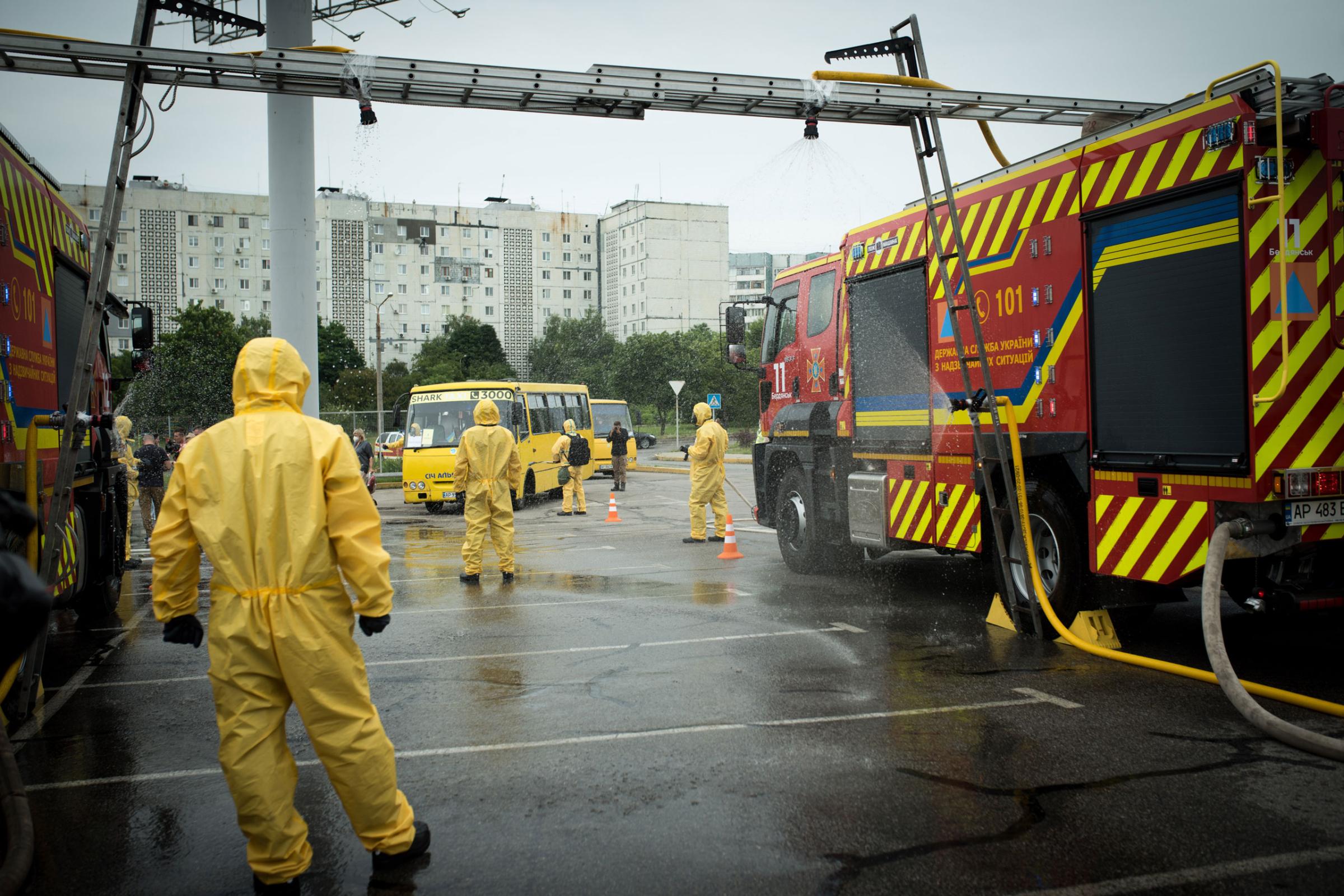SES rescuers in chemical protection suits participate in an emergency services training