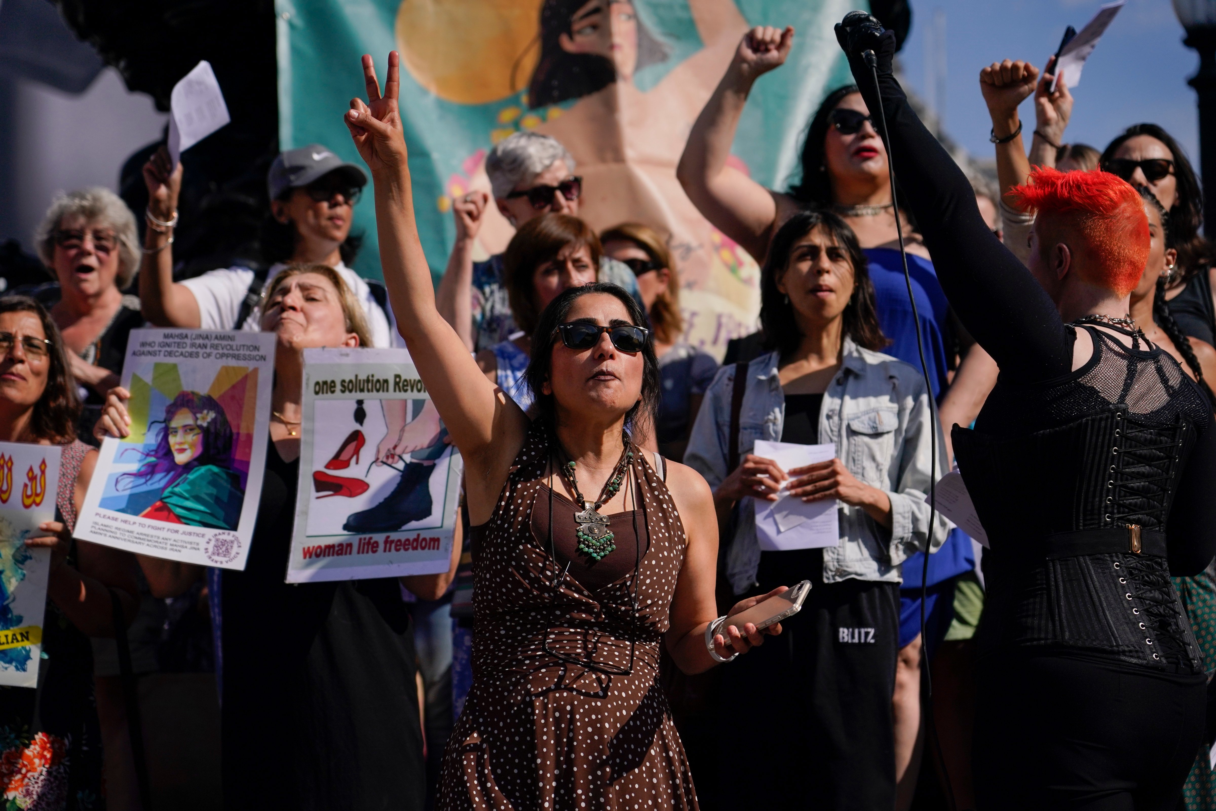 Human rights activists gather in London to mark the anniversary of Mahsa Amini's death on Sept. 16, 2023. (Alberto Pezzali / AP)