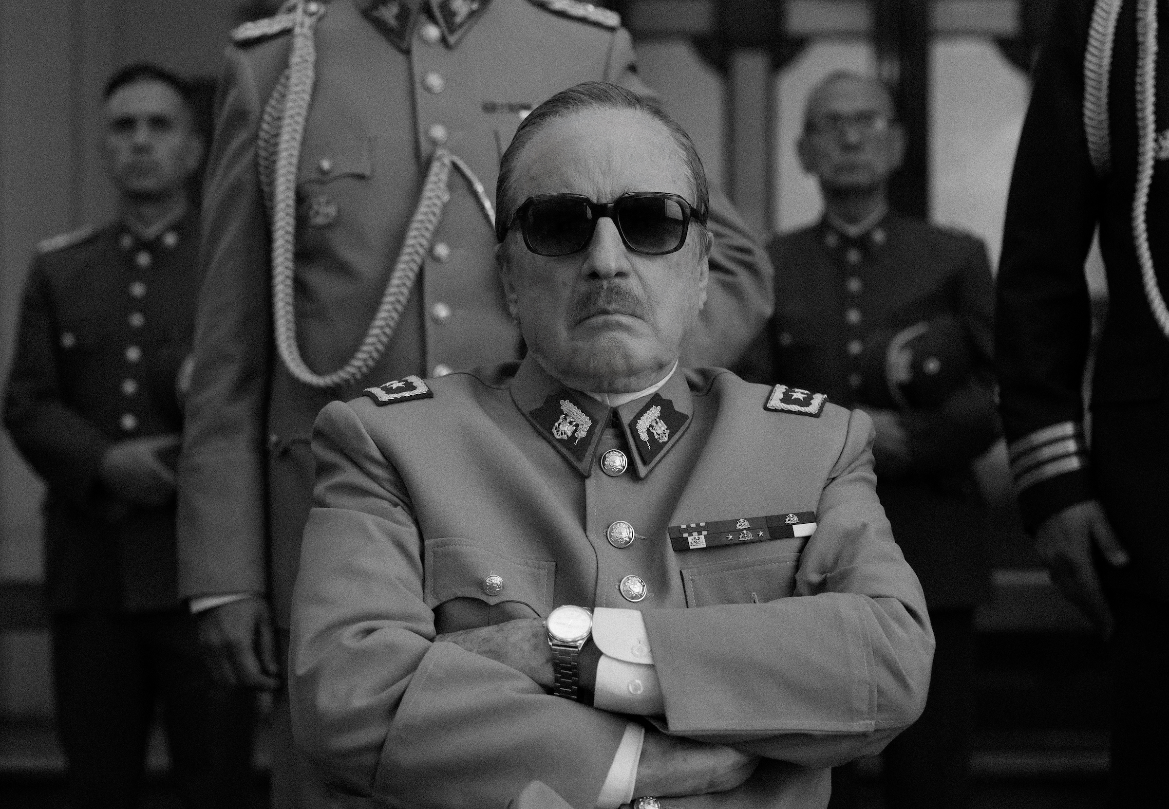 Jaime Vadell as Augusto Pinochet recreates an infamous historical photo. (Pablo Larraín—Netflix)