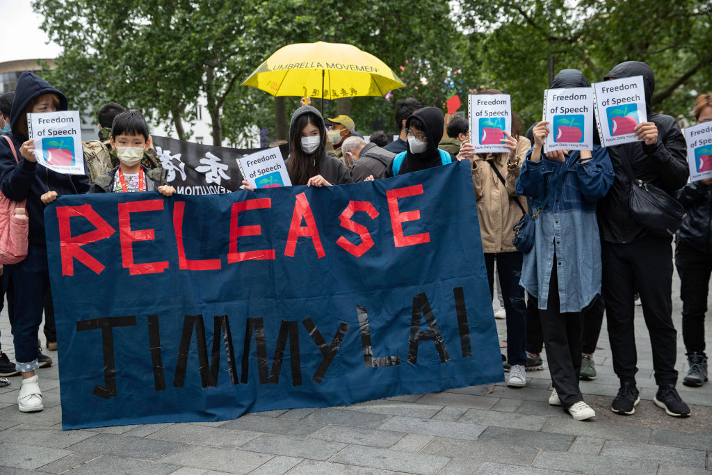 Protesters holding a banner reading, Release Jimmy Lai,