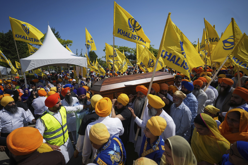 Mourners carry the casket of Sikh community leader and temple president Hardeep Singh Nijjar during a day-long funeral service for him in Surrey, British Columbia, June 25, 2023. (Darryl Dyck—The Canadian Press/AP)
