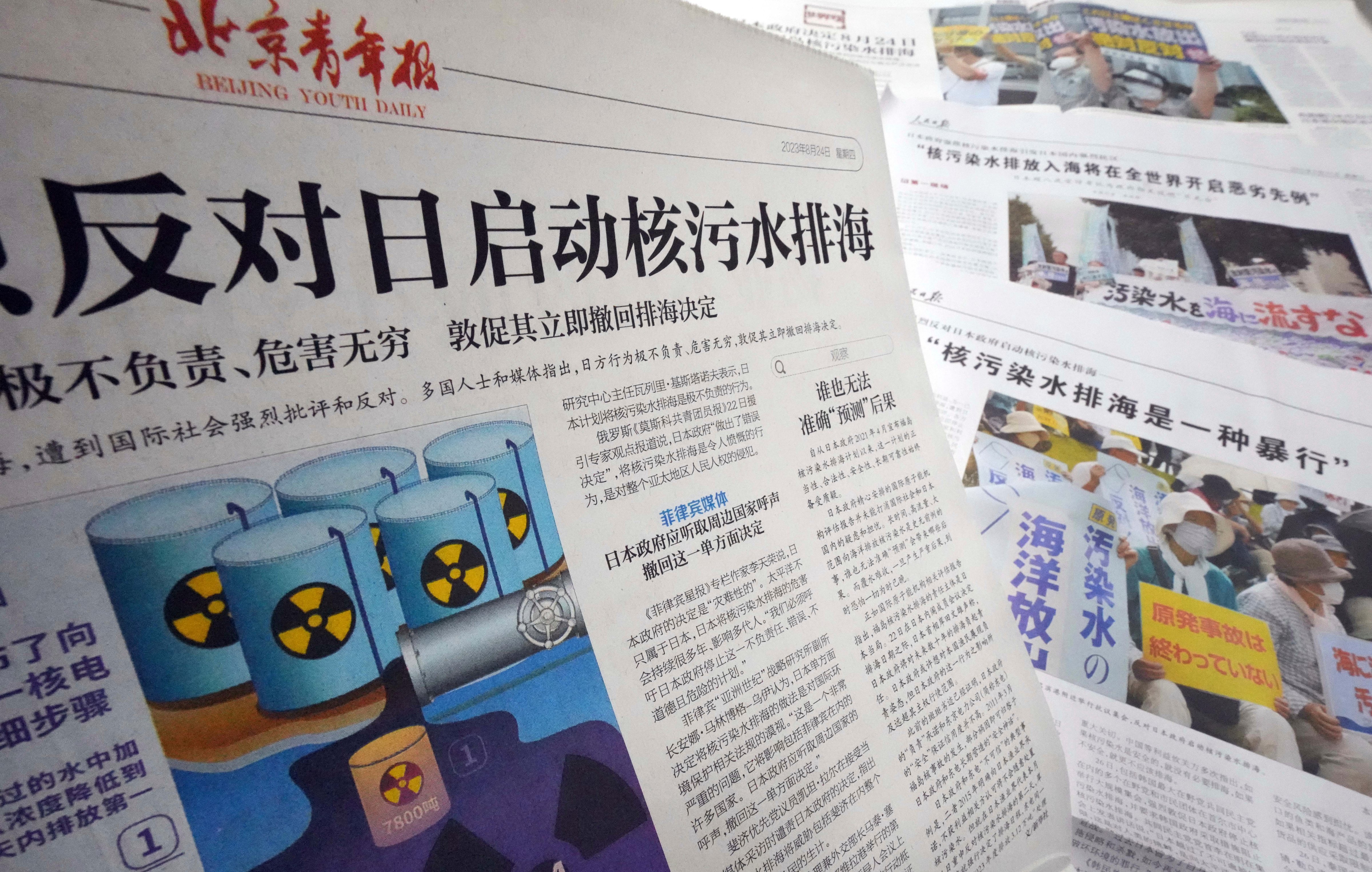 Chinese newspapers report on the release of treated water from the Fukushima nuclear power plant into the Pacific, describing the discharge as "extremely irresponsible" and "an atrocity," in Beijing on Aug. 30, 2023. (Yomiuri Shimbun/AP)