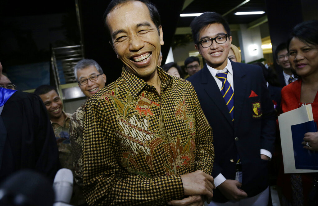 Indonesian President Joko Widodo at the graduation ceremony of his youngest son Kaesang Pangarep in Singapore, Nov. 21, 2014.