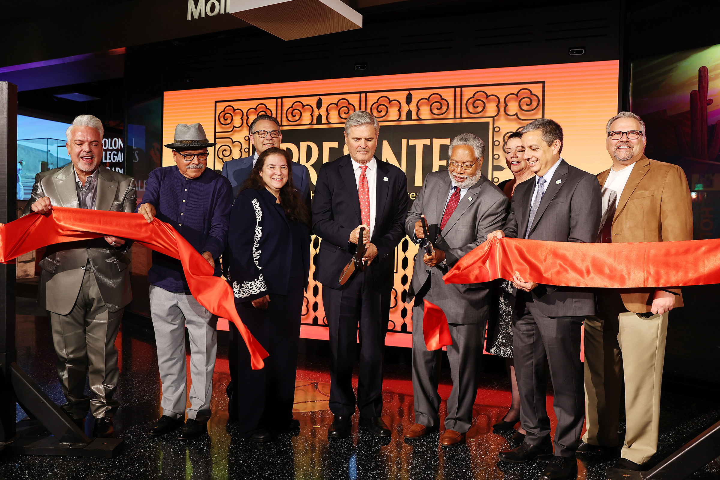 From left: Henry R. Muñoz III, Eduardo Díaz, J. Mario Molina, Martha Molina Bernadett, Steve Case, Lonnie Bunch, III, Josephine Molina, Jorge Zamanillo and John C. Molina cut the opening ribbon during the '¡Presente! A Latino History of the United States' exhibition reception at the National Museum of American History in Washington, D.C., on June 16, 2022. (Tasos Katopodis—Getty Images for Smithsonian Latino Museum)