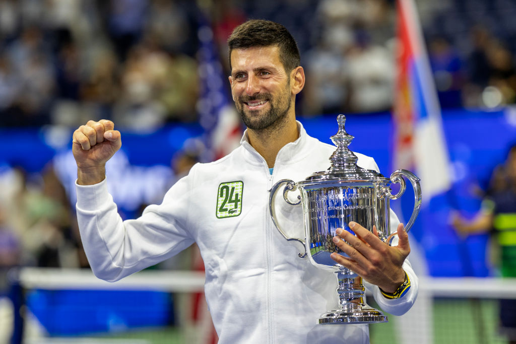 Djokovic holds the U.S. Open winners’ trophy after claiming his 24th major title at the Billie Jean King National Tennis Center’s Arthur Ashe Stadium in Flushing, Queens, on Sunday. (Tim Clayton—Corbis/Getty Images)