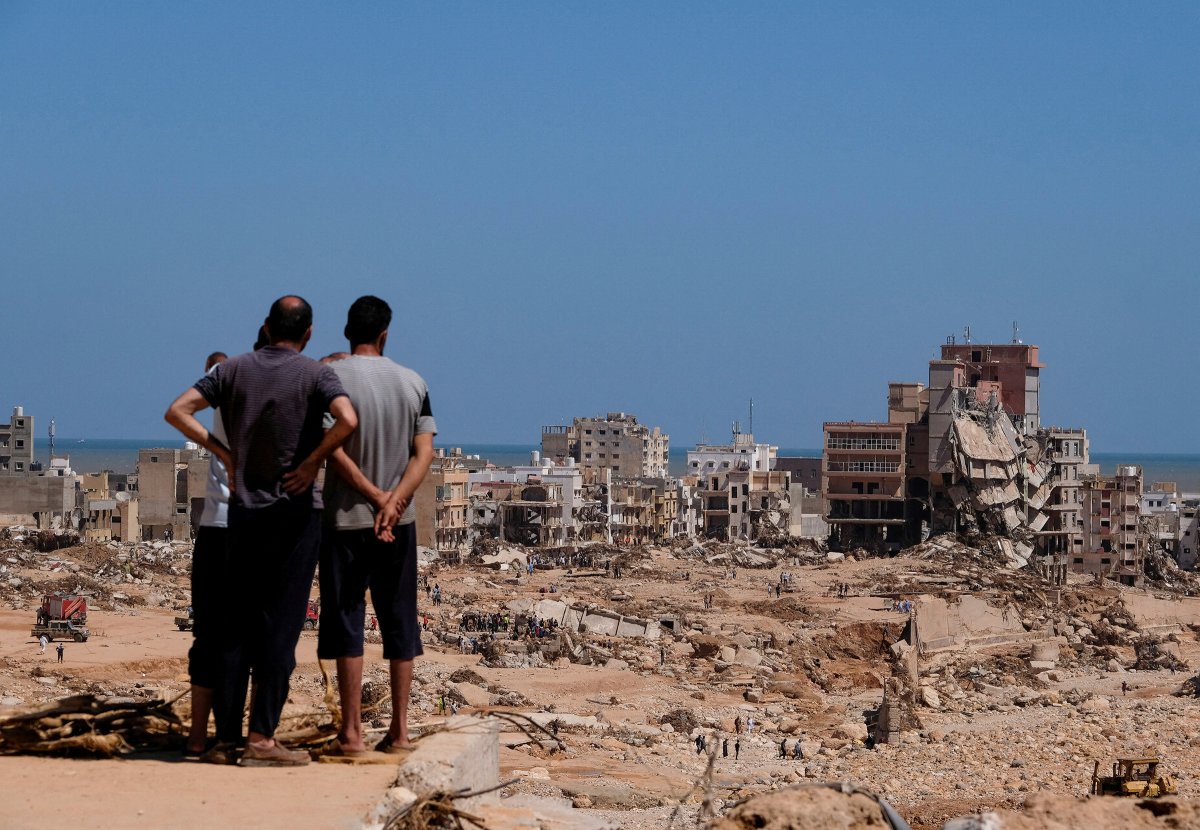 People look at damaged areas in Derna on Sept. 14.