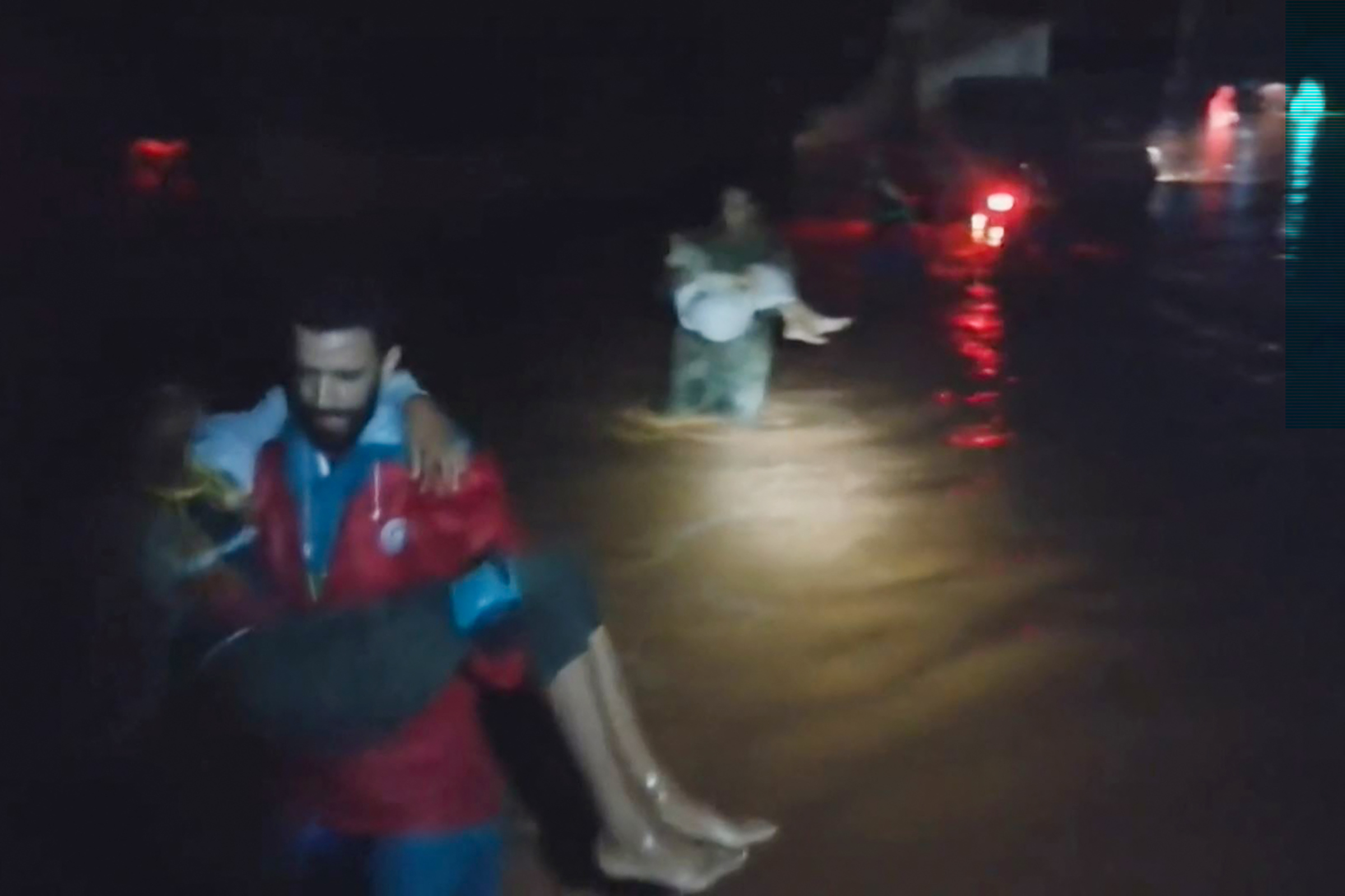 Members of the Libyan Red Crescent rescue people from floods in eastern Libya on Sept. 11.