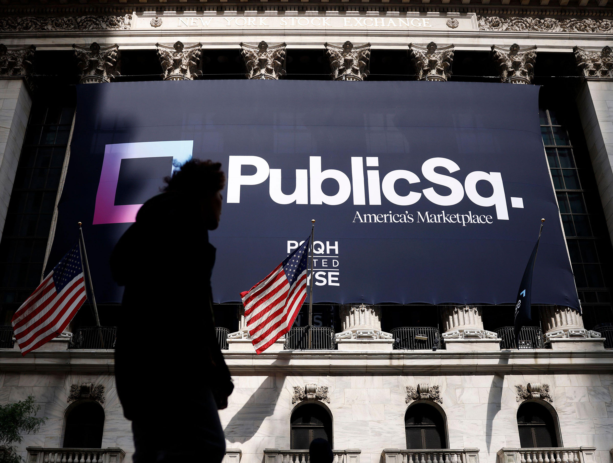 The PublicSq. brand logo hangs outside at the NYSE before the opening bell at the New York Stock Exchange on Wall Street in New York City on Thursday, July 20, 2023
