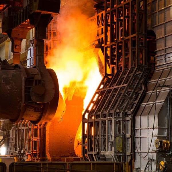 Moving hot metal to a basic oxygen furnace to make steel.