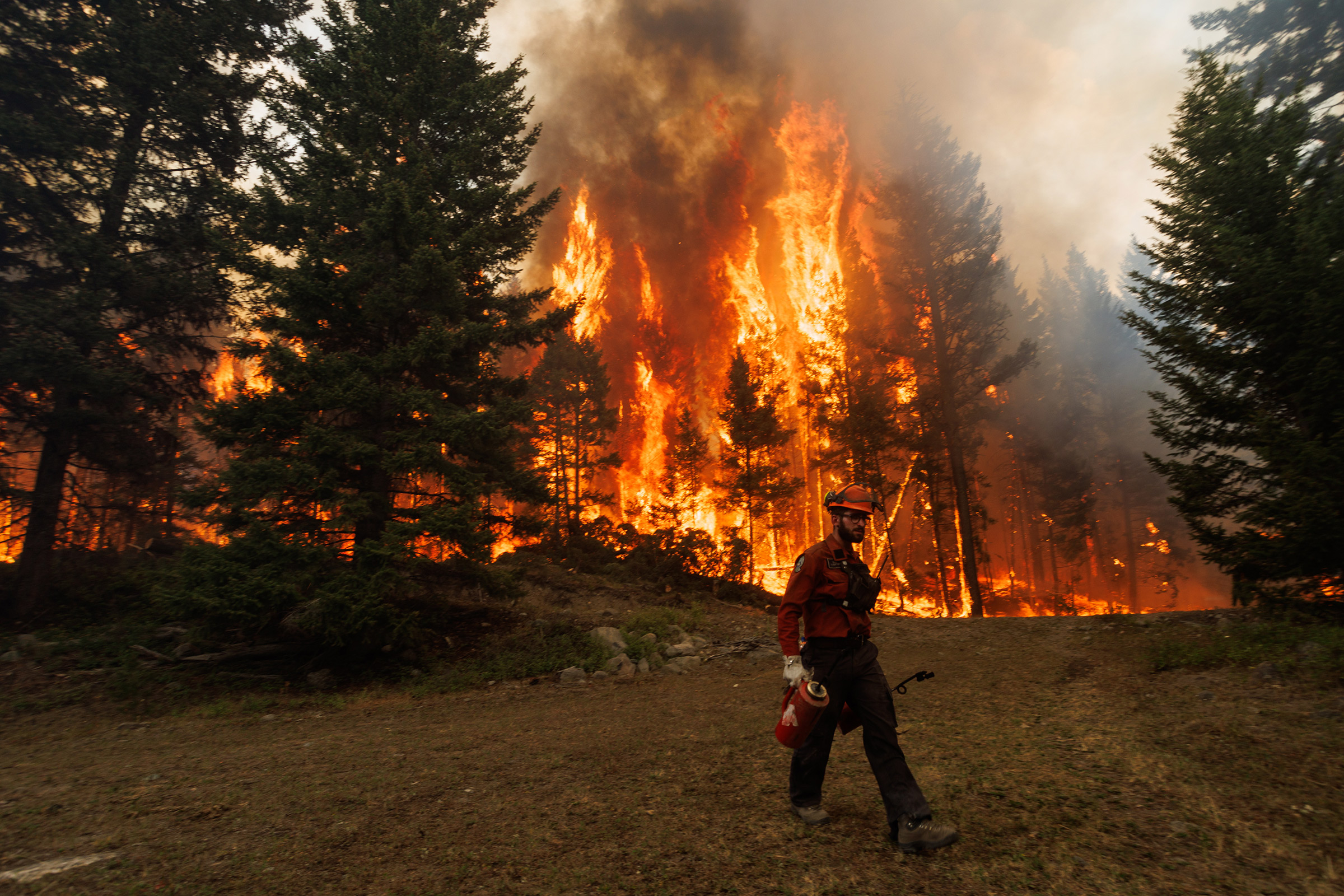 A wind change increased flames during a planned ignition on the Ross Moore Lake wildfire in Kamloops, British Columbia, Canada, on Friday, July 28, 2023. (Jesse Winter—Bloomberg/Getty Images)