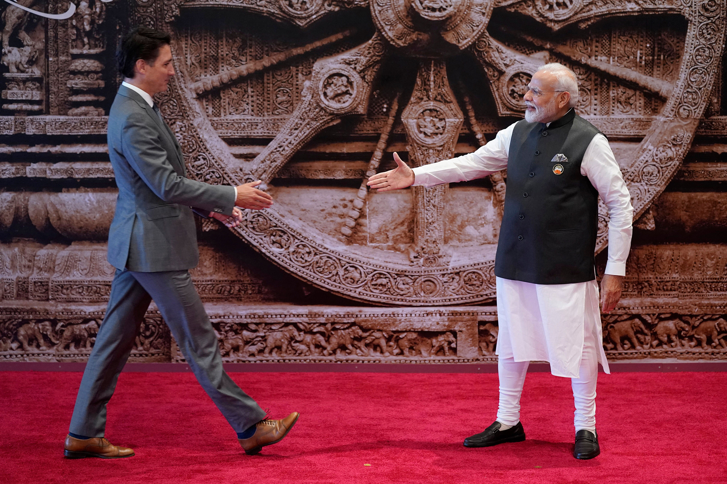 India's Prime Minister Narendra Modi greets Canada's Prime Minister Justin Trudeau ahead of the G20 Leaders' Summit in New Delhi on Sept. 9. (Evan Vucci—POOL/AFP/Getty Images)