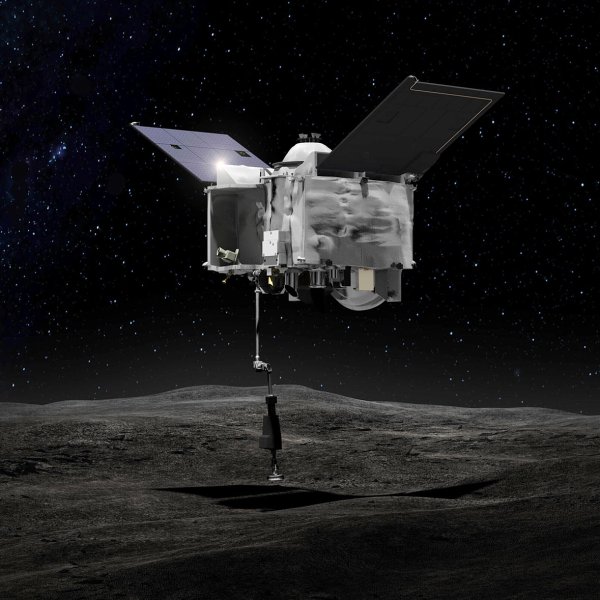 This artist's rendering made available by NASA depicts the OSIRIS-REx spacecraft contacting the asteroid Bennu with the Touch-And-Go Sample Arm Mechanism.
