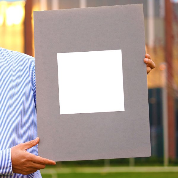 Xiulin Ruan, a Purdue University professor of mechanical engineering, holds up his lab's sample of the whitest paint on record.