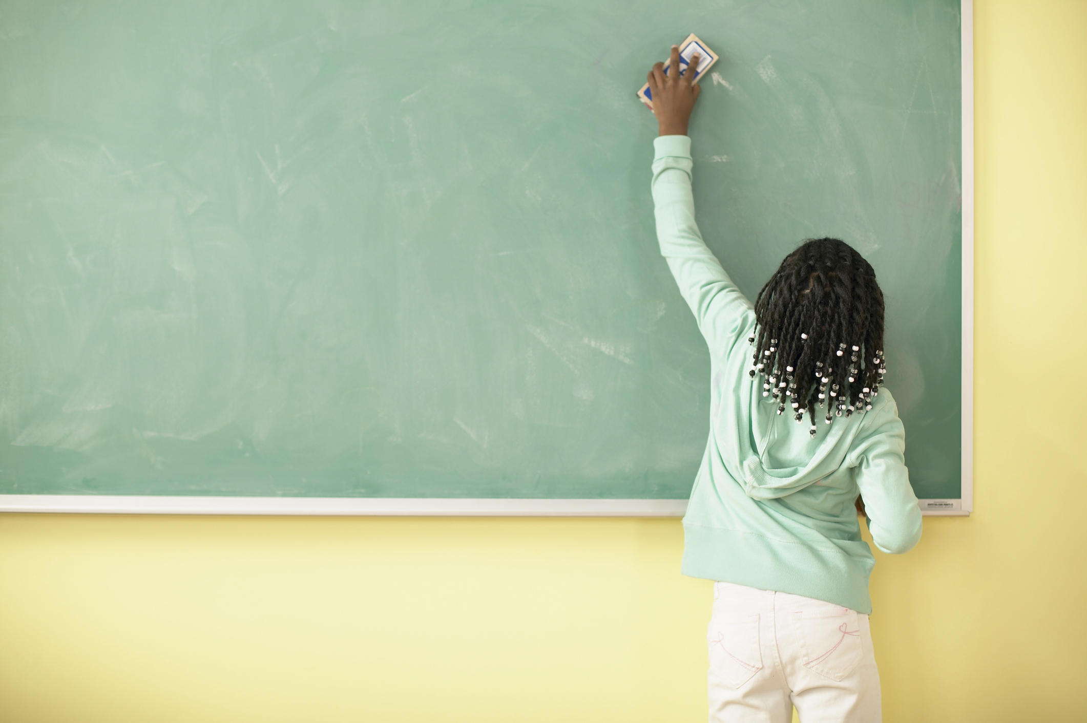 Girl Erasing Blackboard