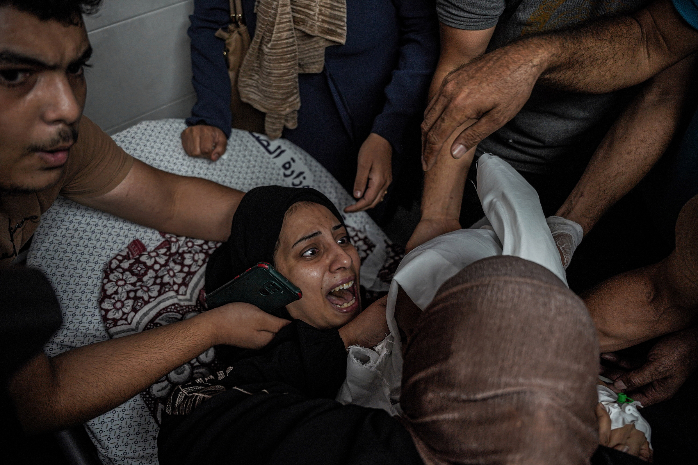 A Palestinian woman mourns her daughter, Mira, who was killed on Oct. 9 following an airstrike.