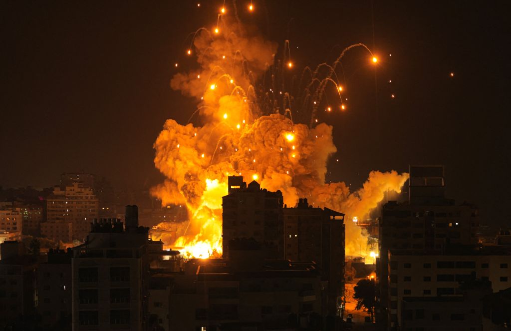 A missile explodes in Gaza City during an Israeli air strike on October 8, 2023. Israel, reeling from the deadliest attack on its territory in half a century, formally declared war on Hamas Sunday as the conflict's death toll surged close to 1,000 after the Palestinian militant group launched a massive surprise assault from Gaza.