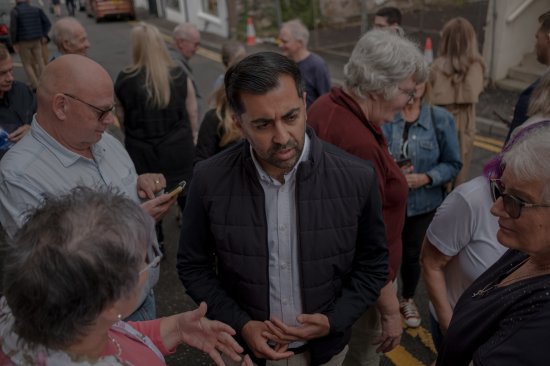Yousaf speaks to supporters outside the SNP office in Largs, Scotland, on Aug. 23.
